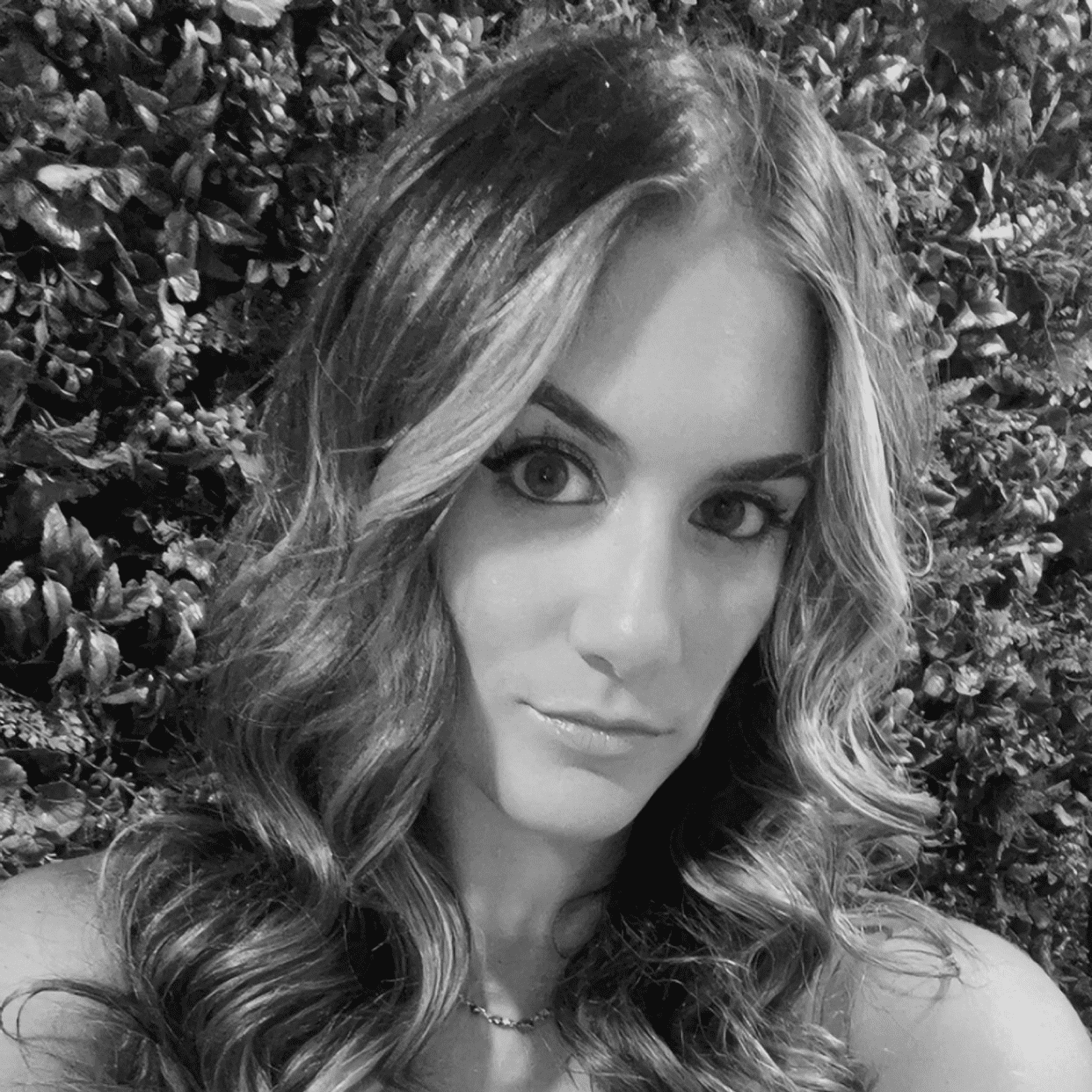 Portrait of Daniela, a professional stylist at Studio 455 Salon, showcasing their expertise and style.