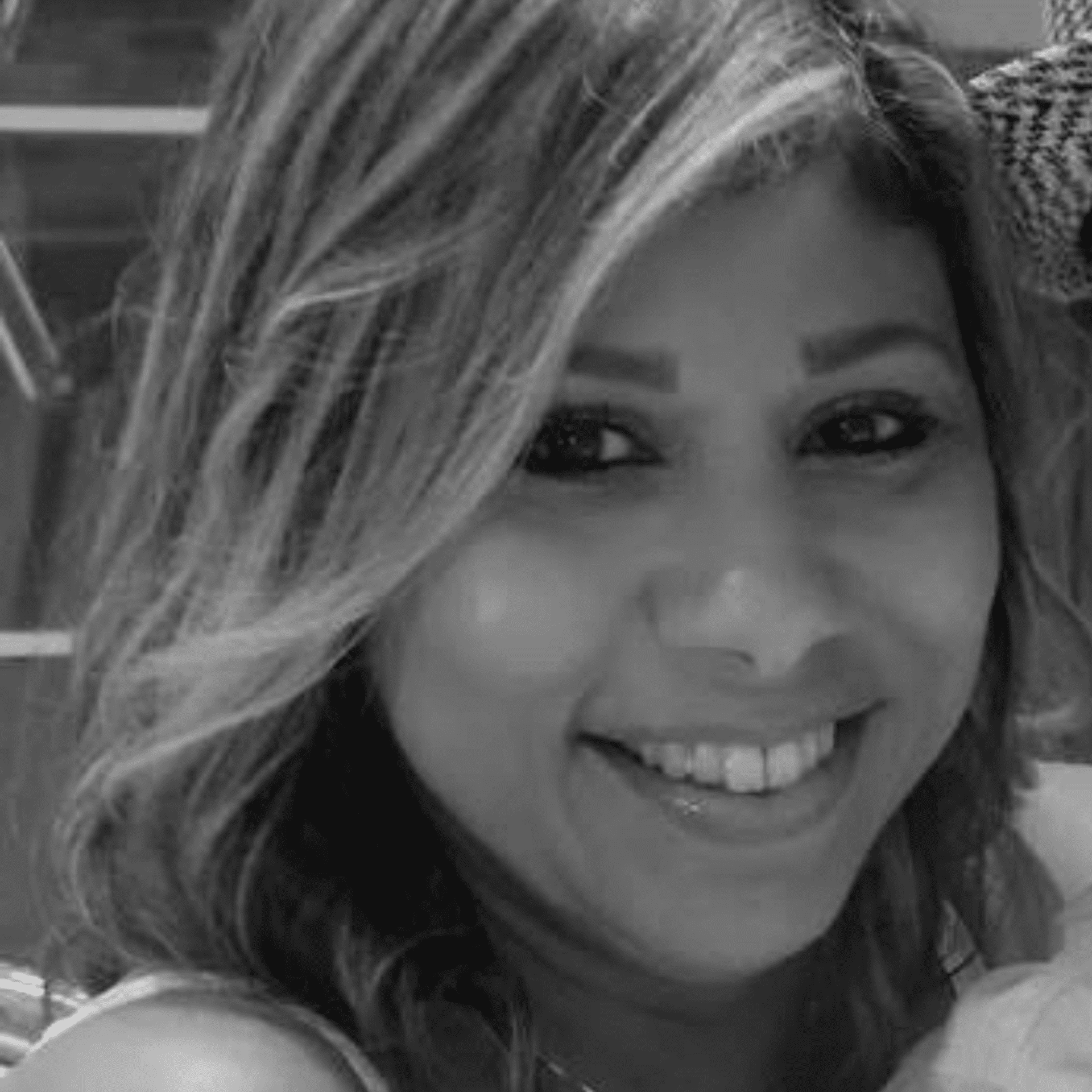 Portrait of Lisette, a professional stylist at Studio 455 Salon, showcasing their expertise and style.