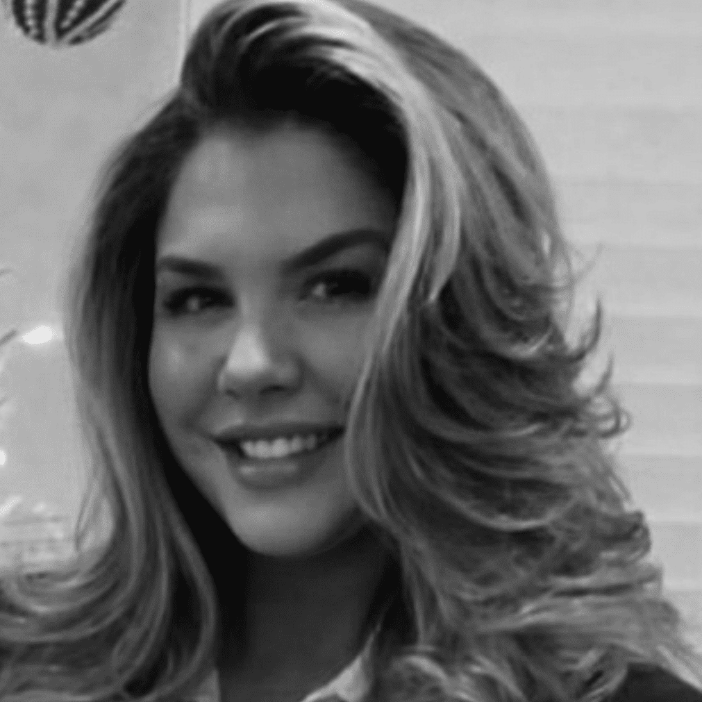 Portrait of Nicole, a professional stylist at Studio 455 Salon, showcasing their expertise and style.