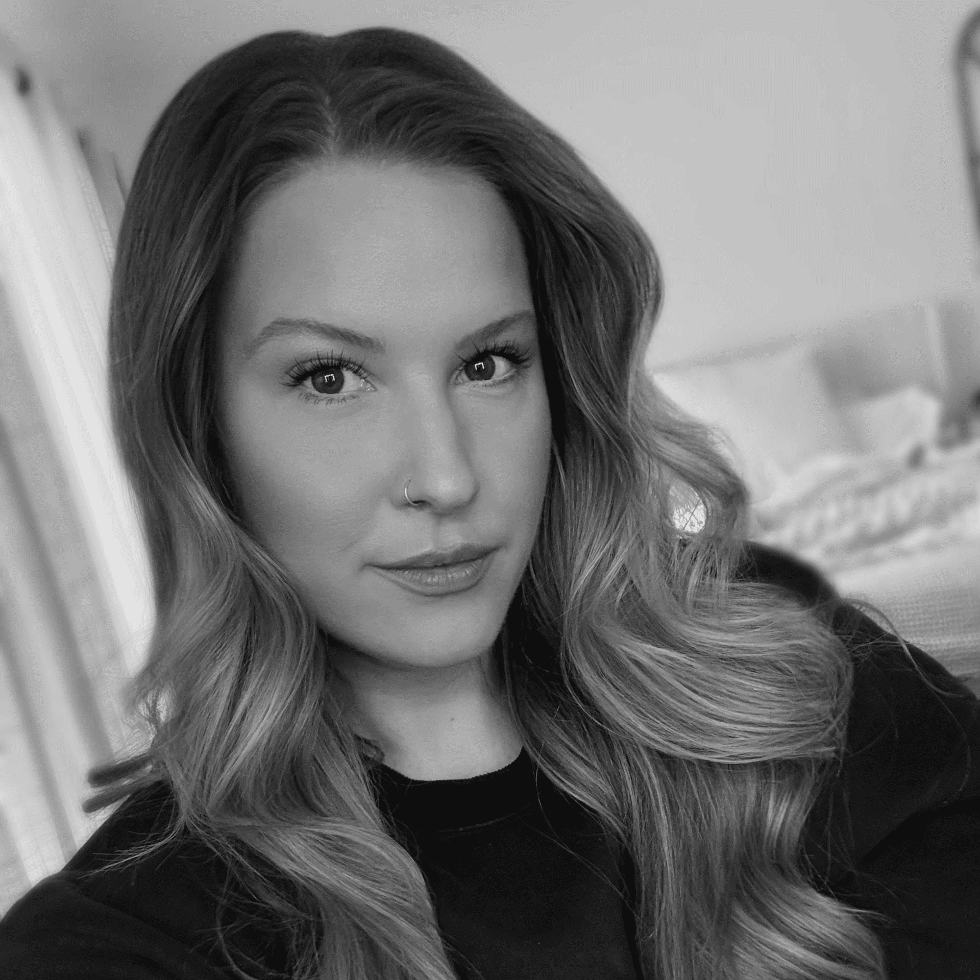 Portrait of Amanda, a professional stylist at Studio 455 Salon, showcasing their expertise and style.