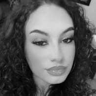 Portrait of Kay, a professional stylist at Studio 455 Salon, showcasing their expertise and style.