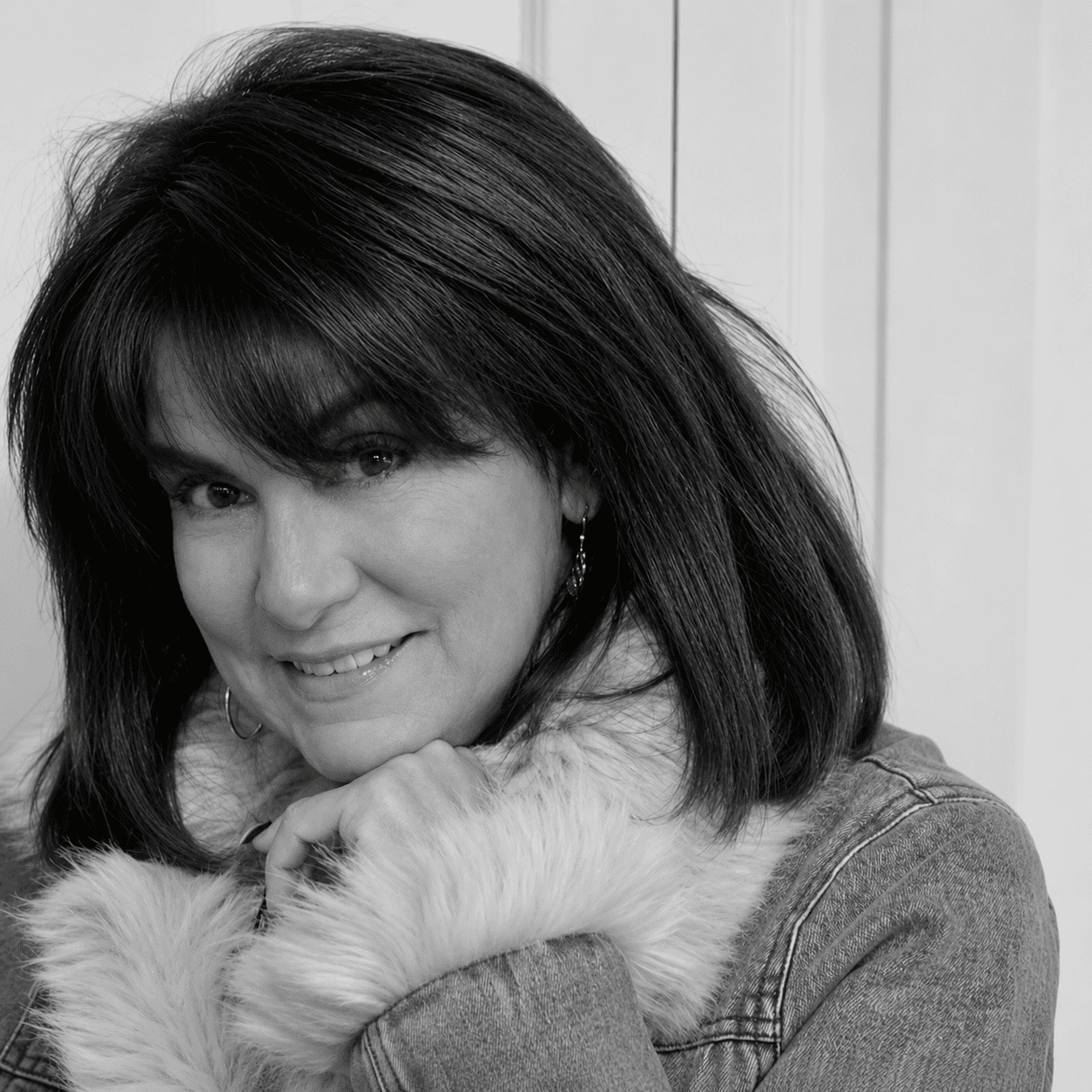 Portrait of Joann, a professional stylist at Studio 455 Salon, showcasing their expertise and style.