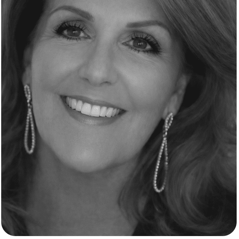 Portrait of Sharon, a professional stylist at Studio 455 Salon, showcasing their expertise and style.