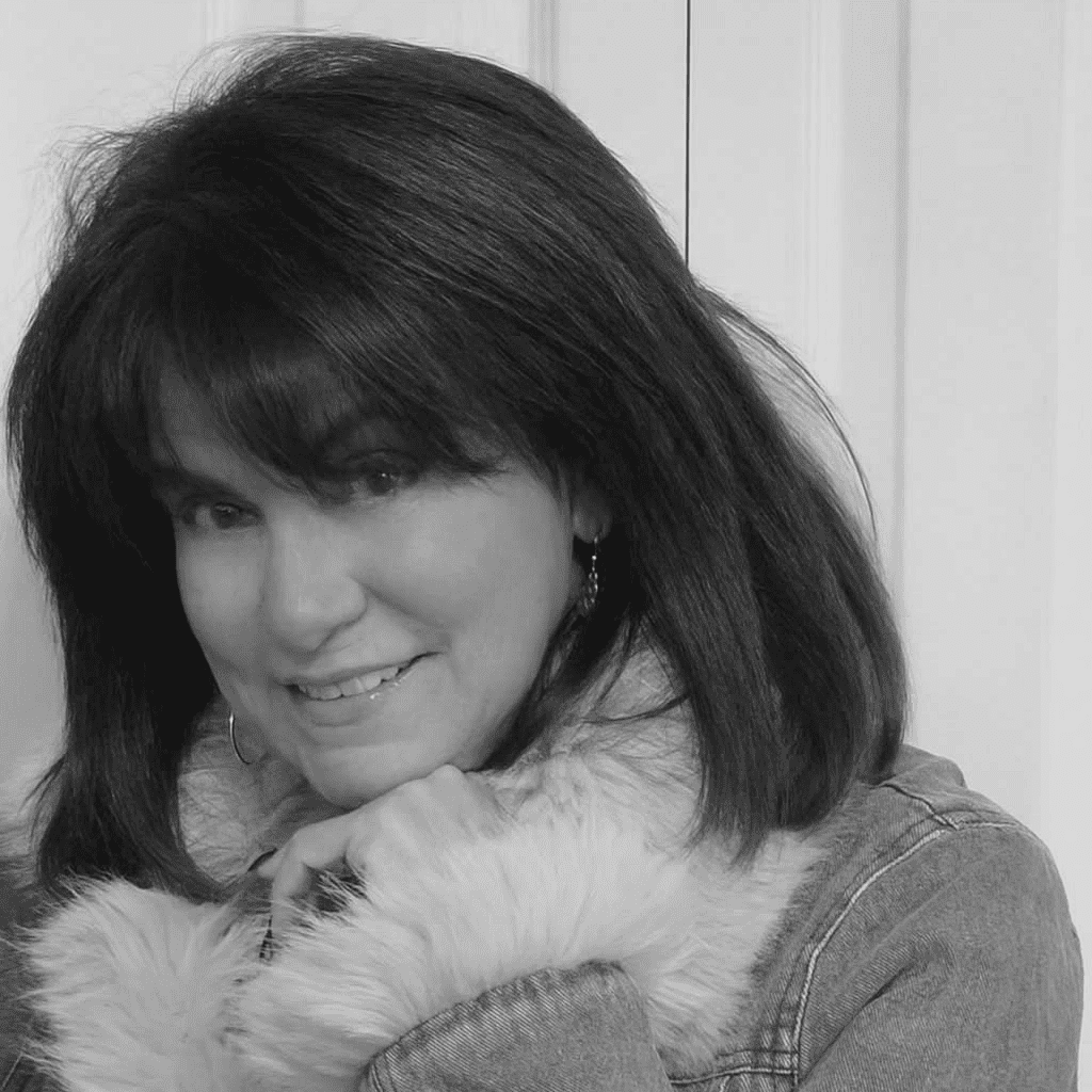 Portrait of Joann, a professional stylist at Studio 455 Salon, showcasing their expertise and style.